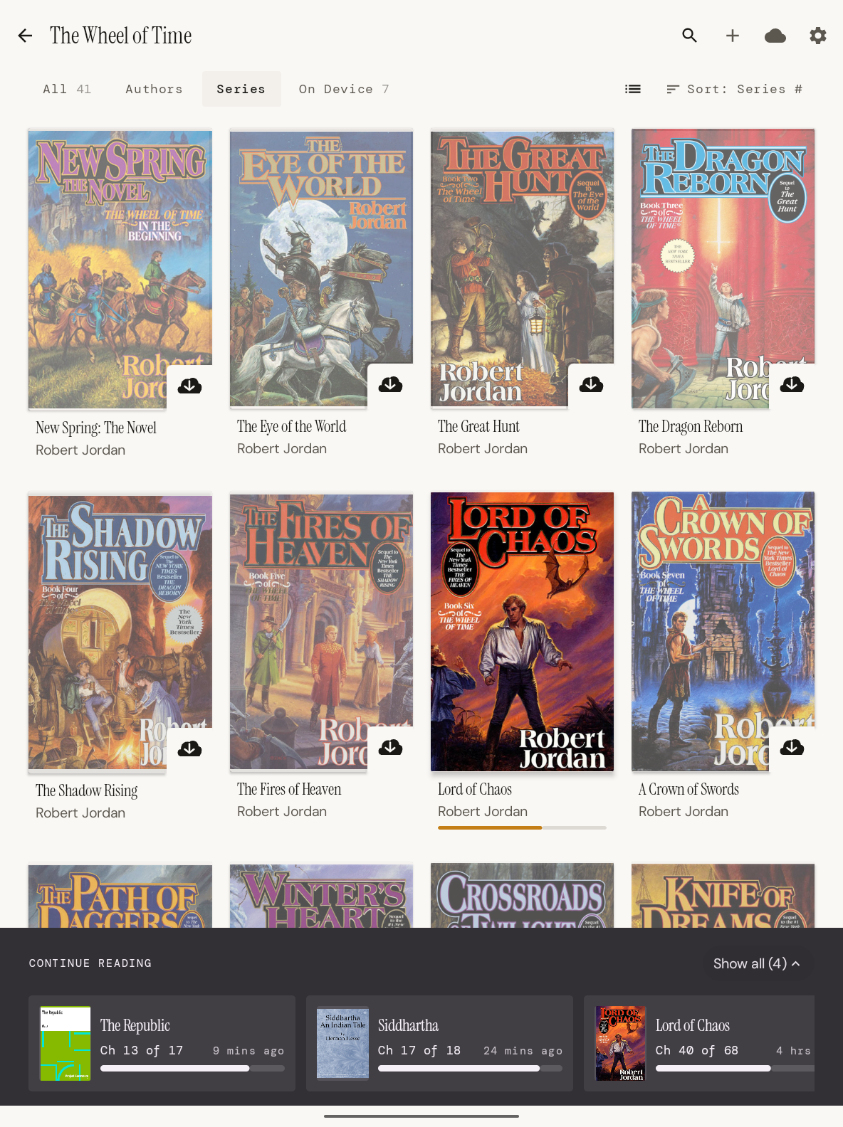 Series view showing The Wheel of Time collection with cover art, download badges, and continue-reading dock